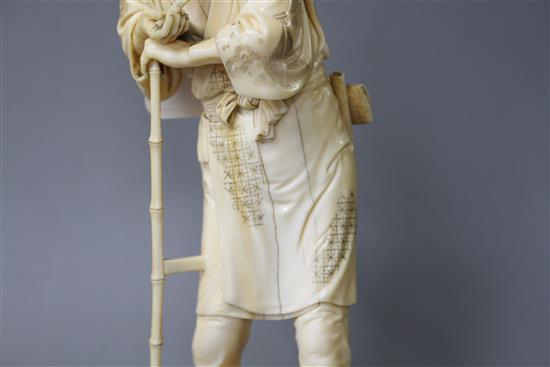 A Japanese Tokyo School ivory okimono, carved as a farmer above a chicken, Meiji period, signed, 24cm